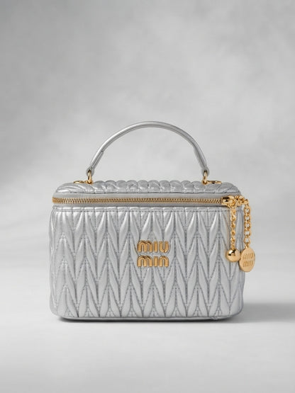 miu miu silver matelassé leather vanity case with top handle and gold zipper