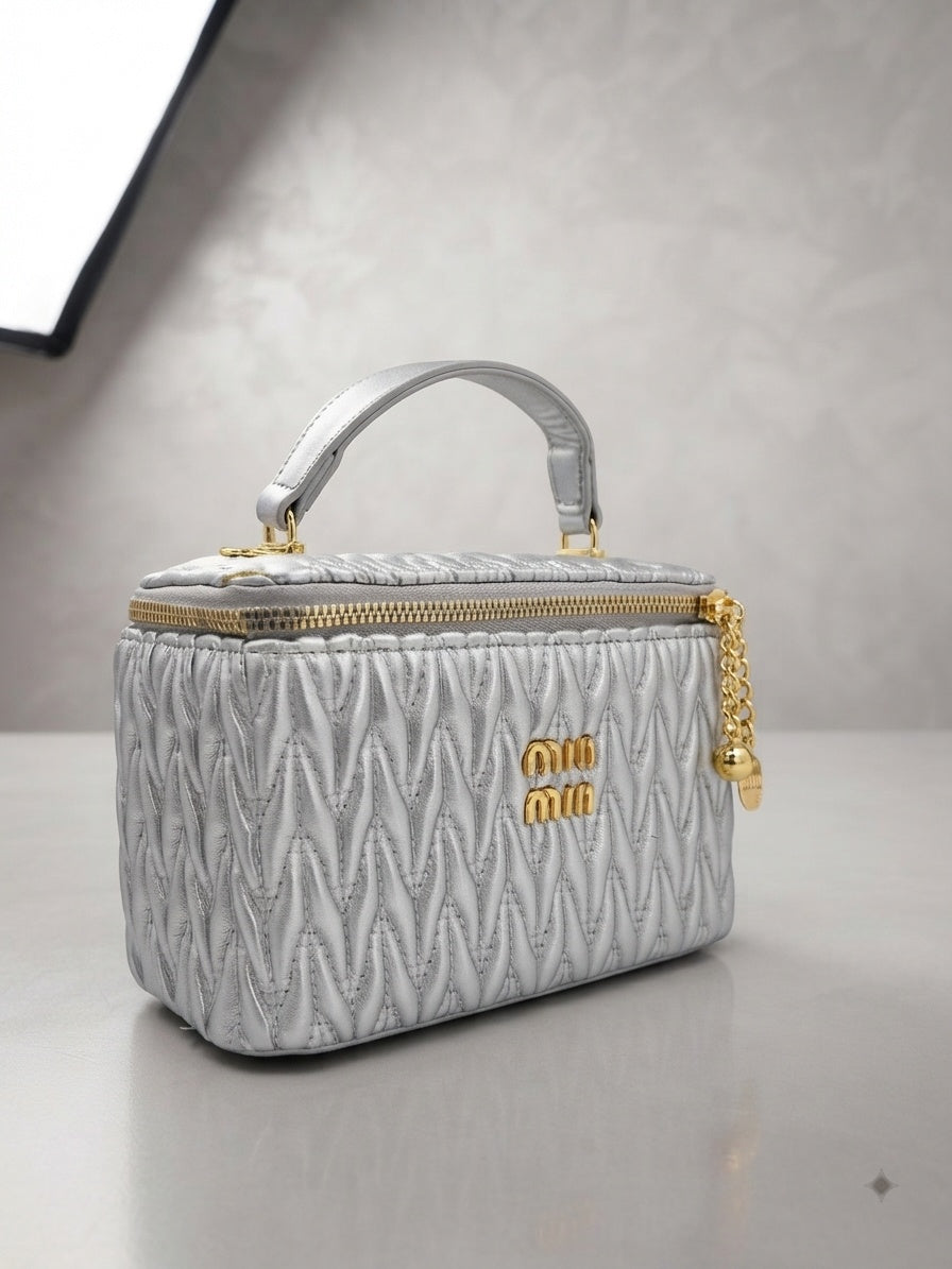miu miu Matelassé leather vanity case in silver with top handle and gold zipper