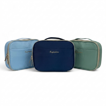 Set of three zippered toiletry bags: light blue, navy, and green, each with handle