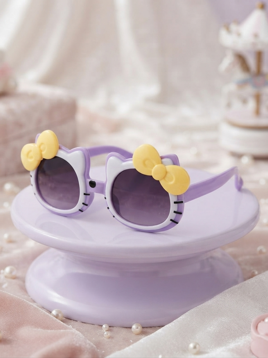 Kids cat-style sunglasses with dark lenses, purple frame, and yellow bow accents