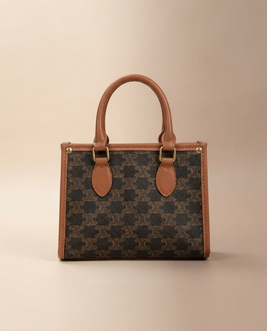 Brown patterned structured tote bag with tan handles and top front leather tabs