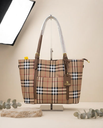 Beige plaid tote bag with brown handles, hanging charm, and tall interior lining