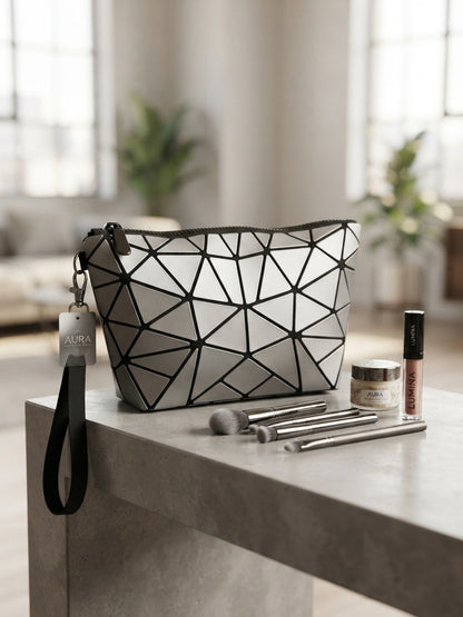 Geometric origami clutch wristlet bag in black with silver geometric pattern and wrist strap