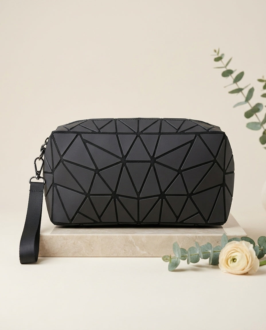 Black geometric luminous cosmetic pouch with wristlet strap and zipper
