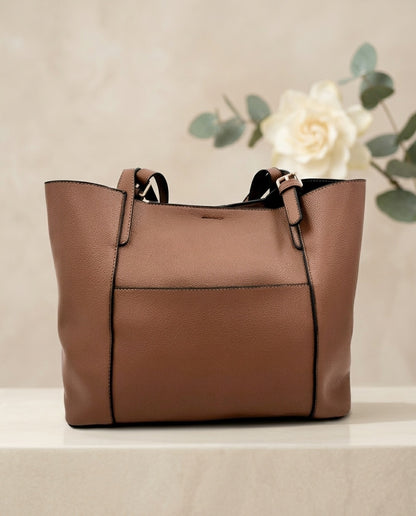 Tan structured tote bag with top handles and front center panel seam