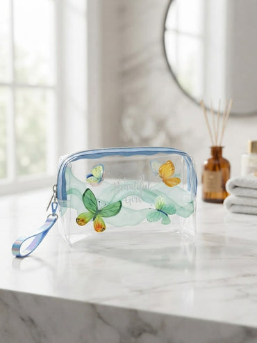 Transparent cosmetic bag with green and yellow butterflies and flowers, top zipper and wrist strap
