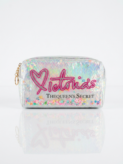 Iridescent woven makeup pouch in silver with pink heart logo, top zipper and wrist strap