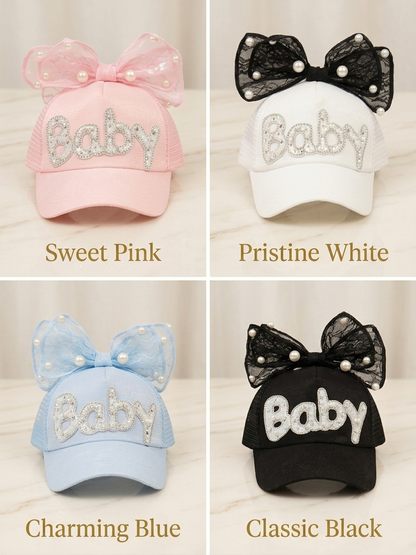 Kids trucker caps in pink, white, blue, and black with bow and rhinestone 'Baby'