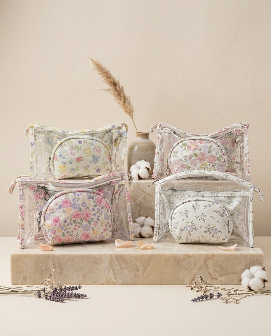 Assorted clear dome floral cosmetic pouches showing multiple sizes and styles