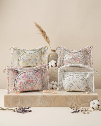 Assorted clear dome floral cosmetic pouches showing multiple sizes and styles