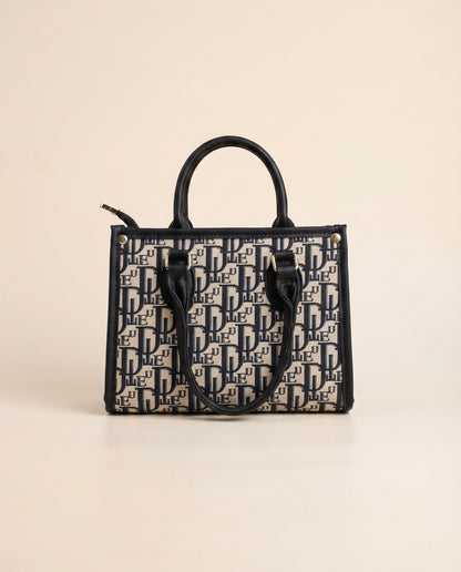 Structured tote bag with navy-and-black logo print, top handles, and front letter pattern