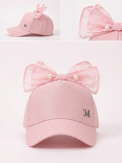 Kids pink glitter cap with sheer lace bow and pearl beads, side M patch