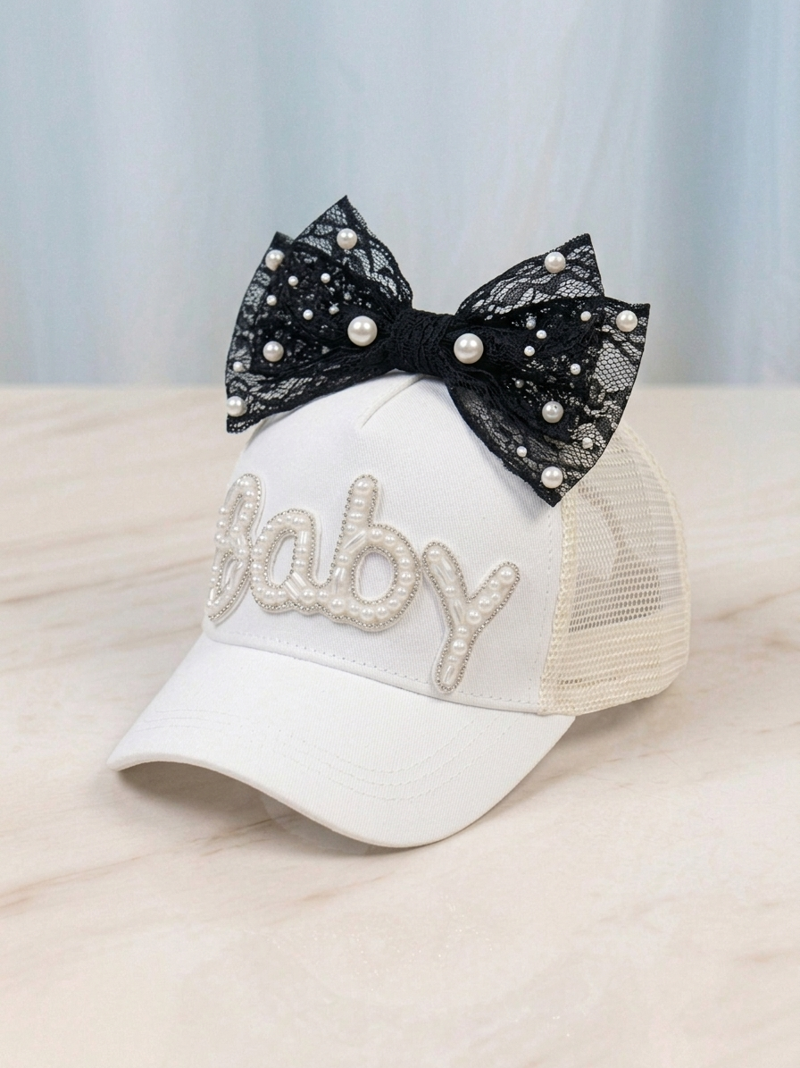 Kids white trucker cap with black bow and pearl-studded rhinestone 'Baby'