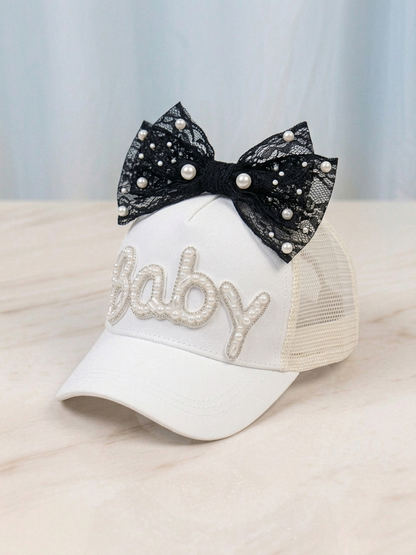 Kids white trucker cap with black bow and pearl-studded rhinestone 'Baby'