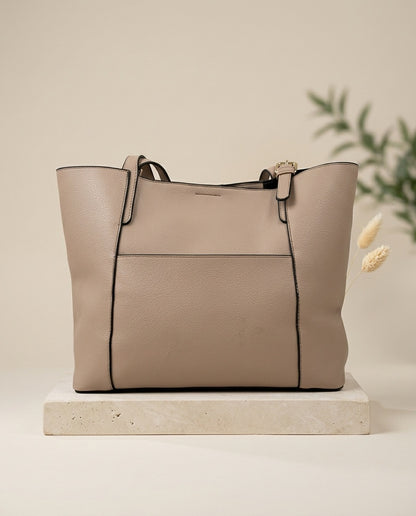 Light beige structured tote bag with top handles, front panel, and side gussets