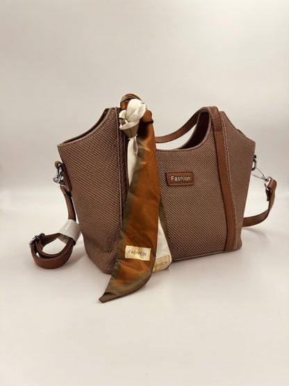 Dark brown textured structured top-handle bag with draped scarf and crossbody strap