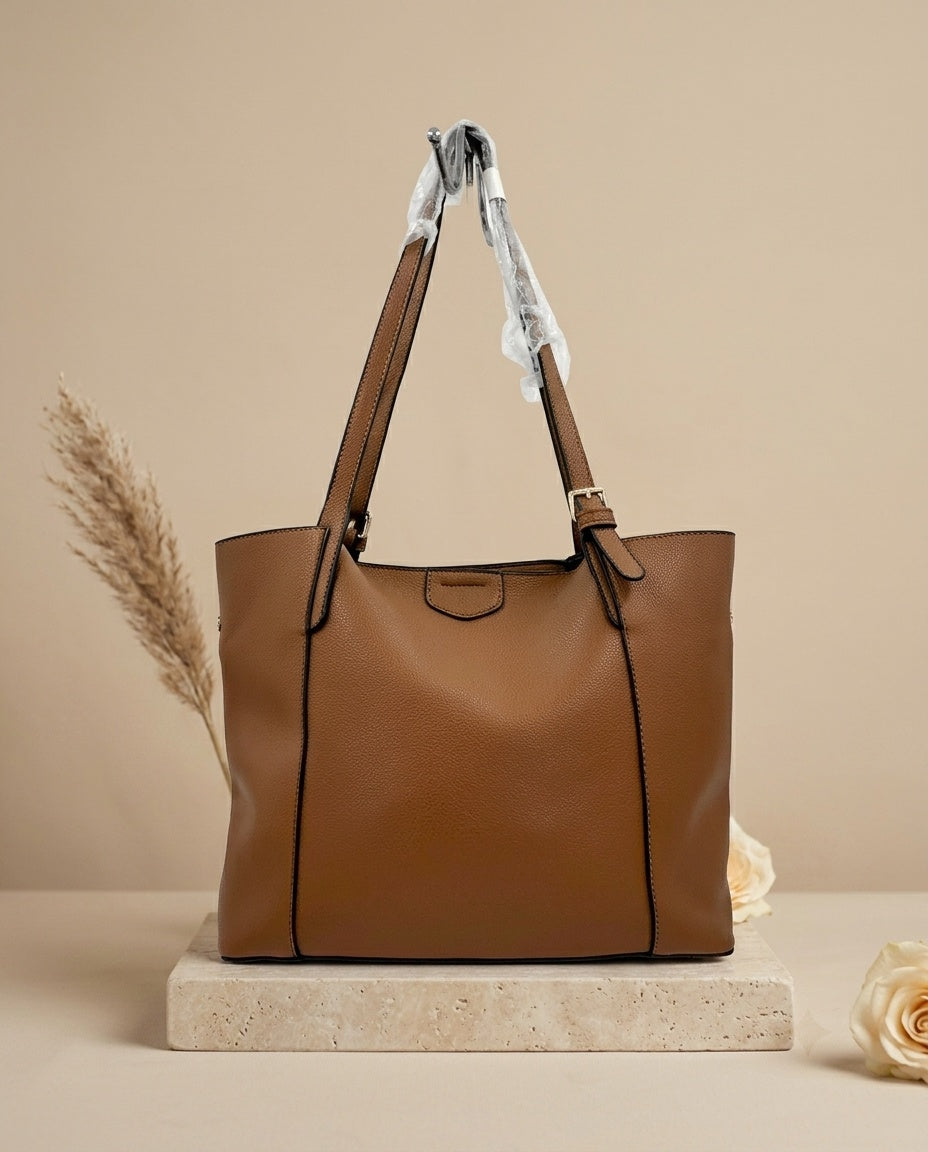 Brown structured tote bag with top handles, side gussets, and front center panel