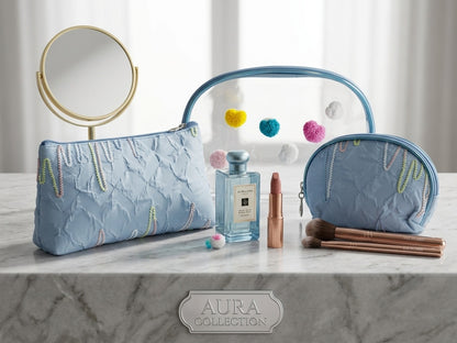 Blue nested clear cosmetic pouches with fuzzy heart appliques and gold-toned zipper