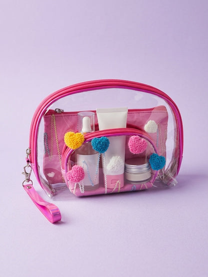 Pink clear nested cosmetic pouches with fuzzy heart appliques and wrist strap