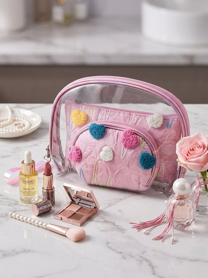 Pink clear nested cosmetic pouch set with fuzzy heart appliques and zipper compartments