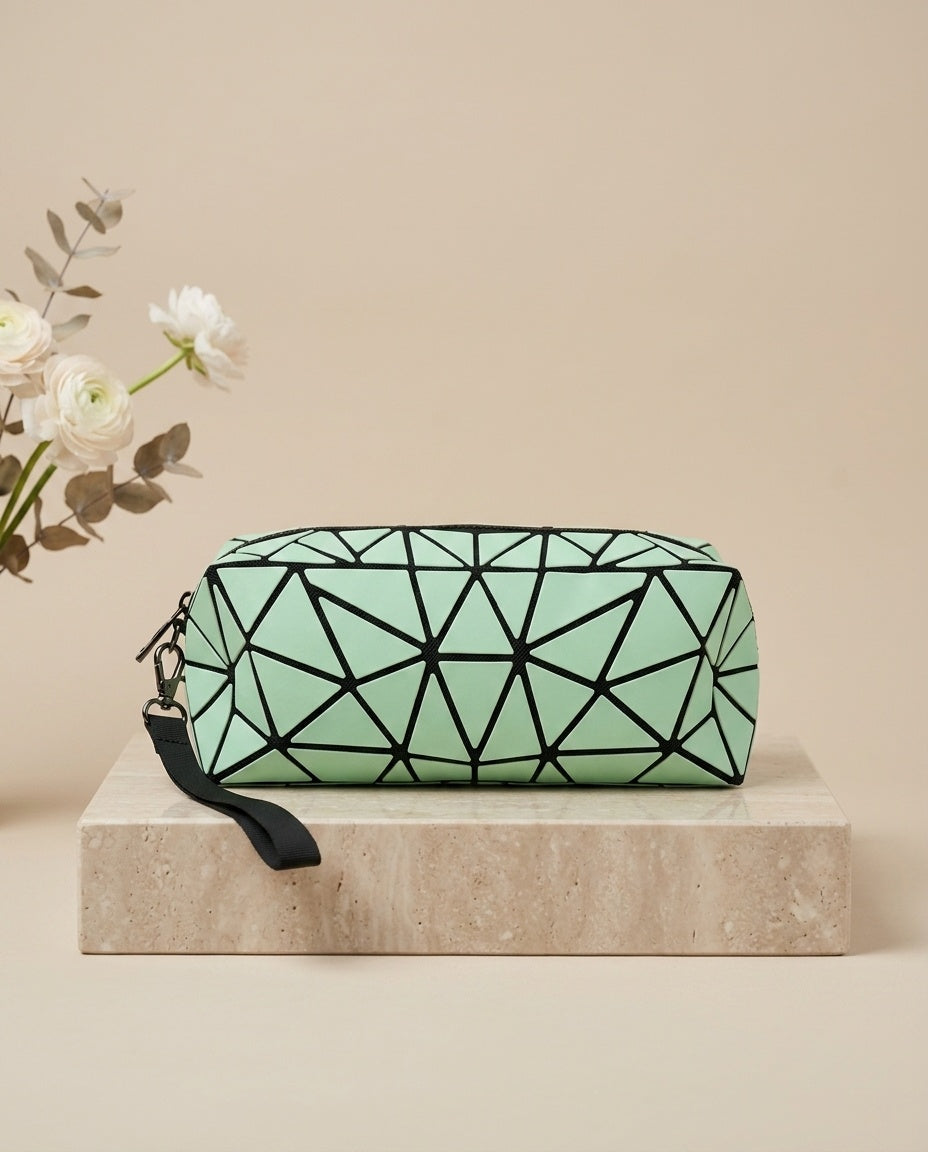 Light green geometric cosmetic pouch with wristlet strap and zipper
