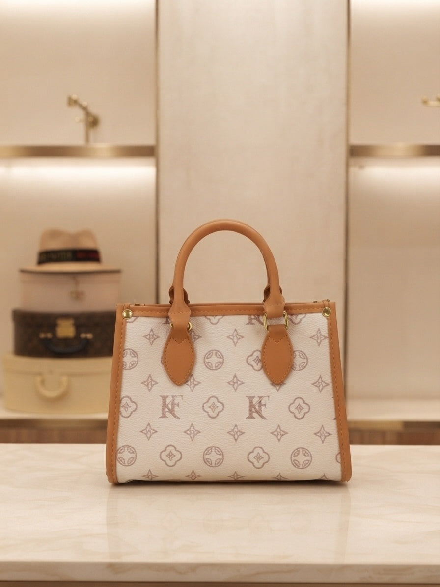 Structured monogram tote bag with flower charm, top handles, tan trim, white canvas