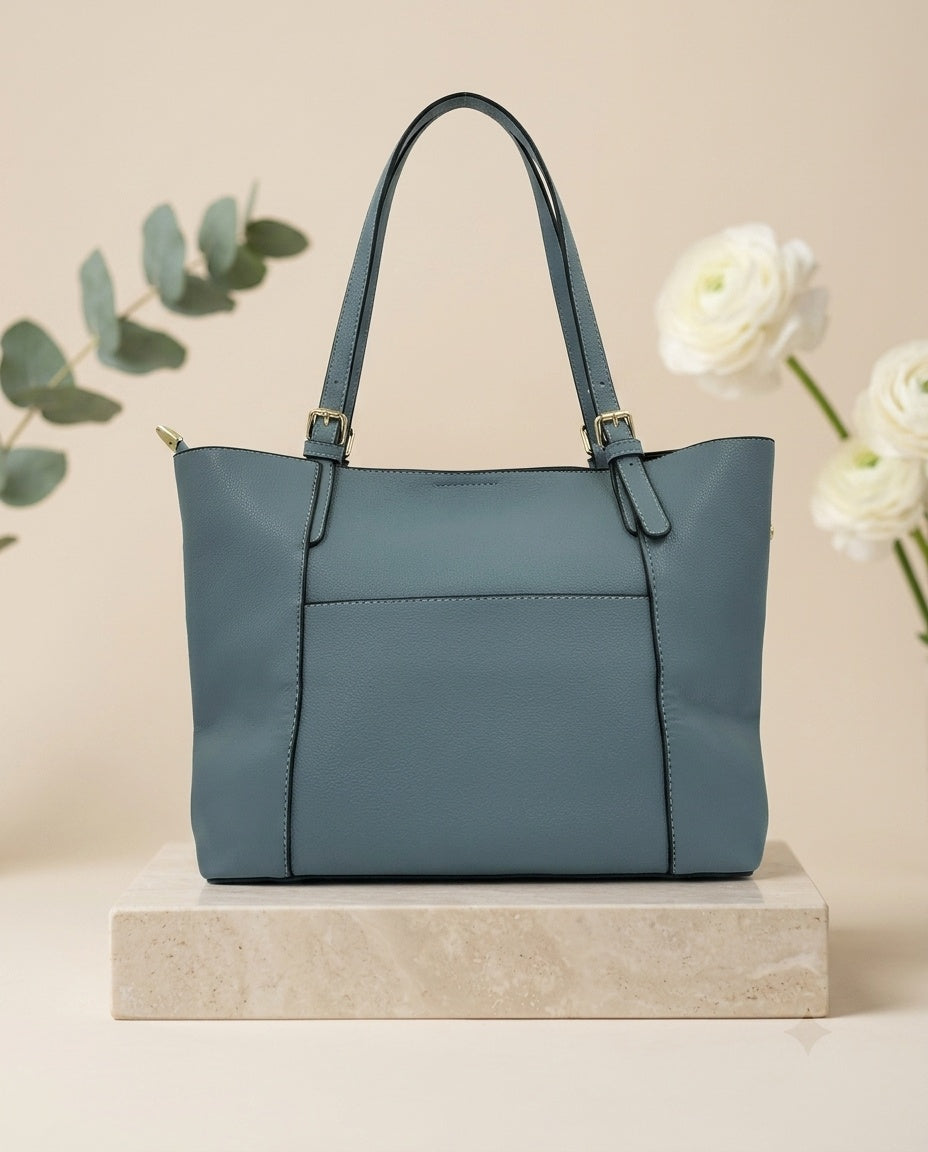 Teal-blue structured tote bag with top handles and front seam panel