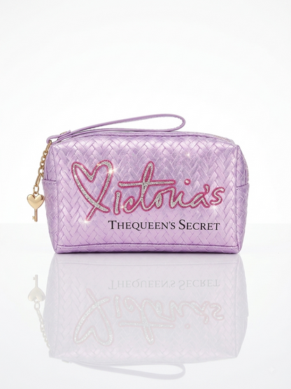 Iridescent woven makeup pouch in lavender with 'Victoria’s THE QUEEN’S SECRET' print